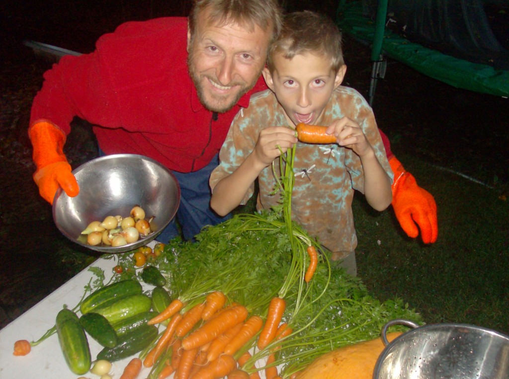 Luke and Liam washing our garden's harvest